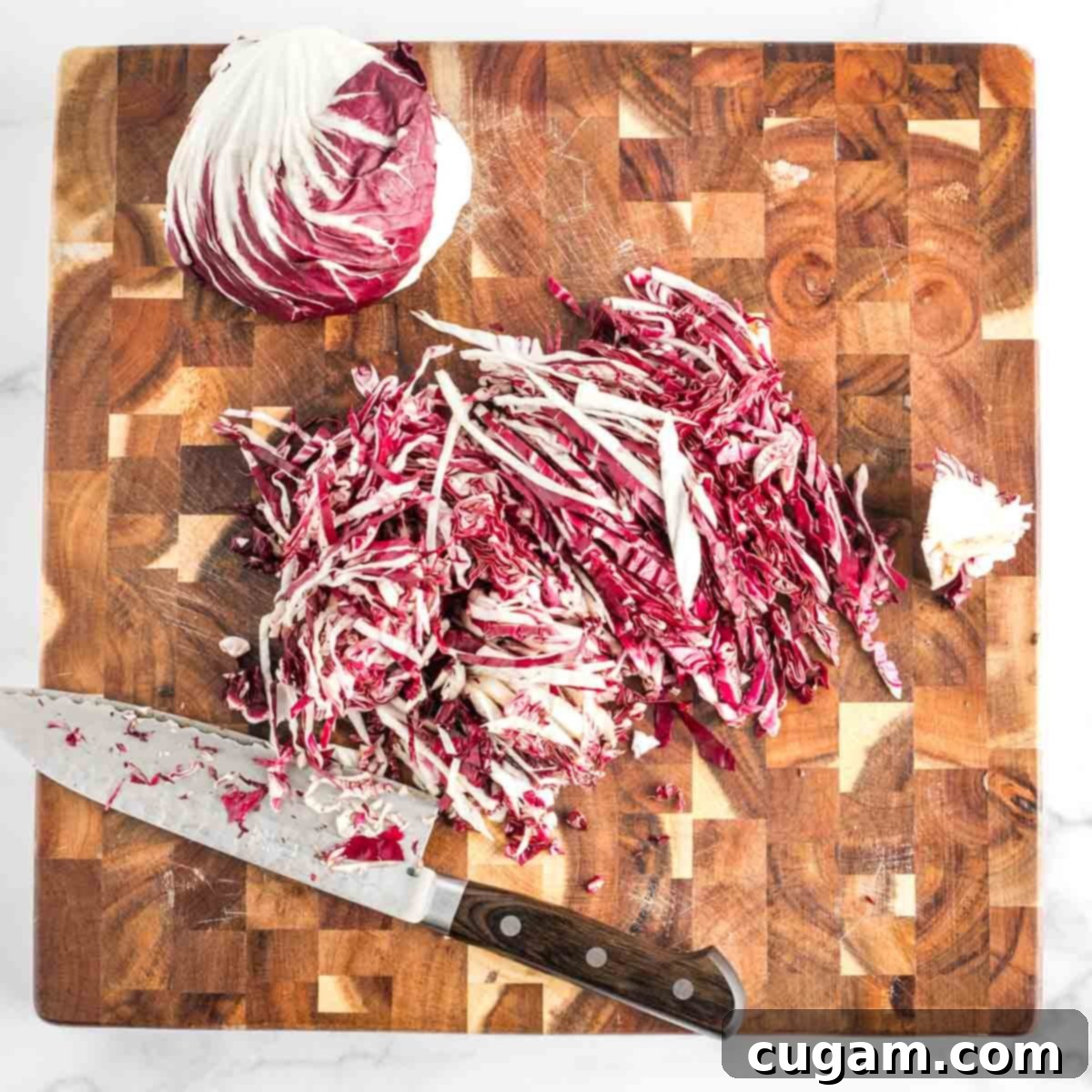 Vibrant Radicchio Chickpea Salad with Tahini 6 Half a head of radicchio, cored and thinly sliced. The other half sits on the cutting board, cut side down.