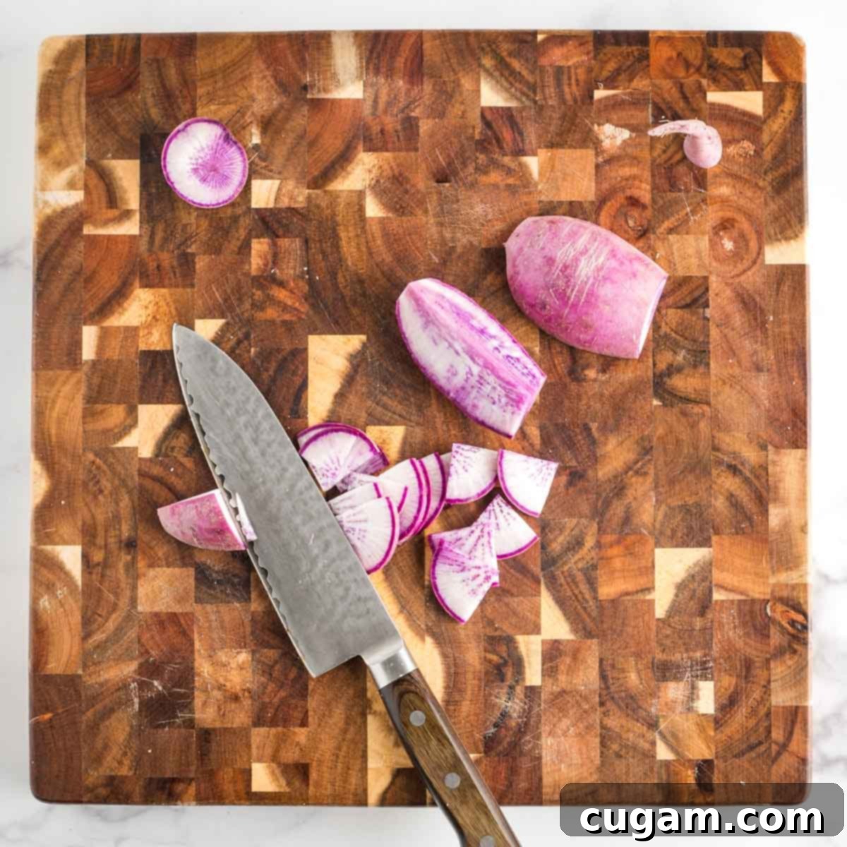 Vibrant Radicchio Chickpea Salad with Tahini 9 Purple daikon radish cut into quarters and then thinly sliced.