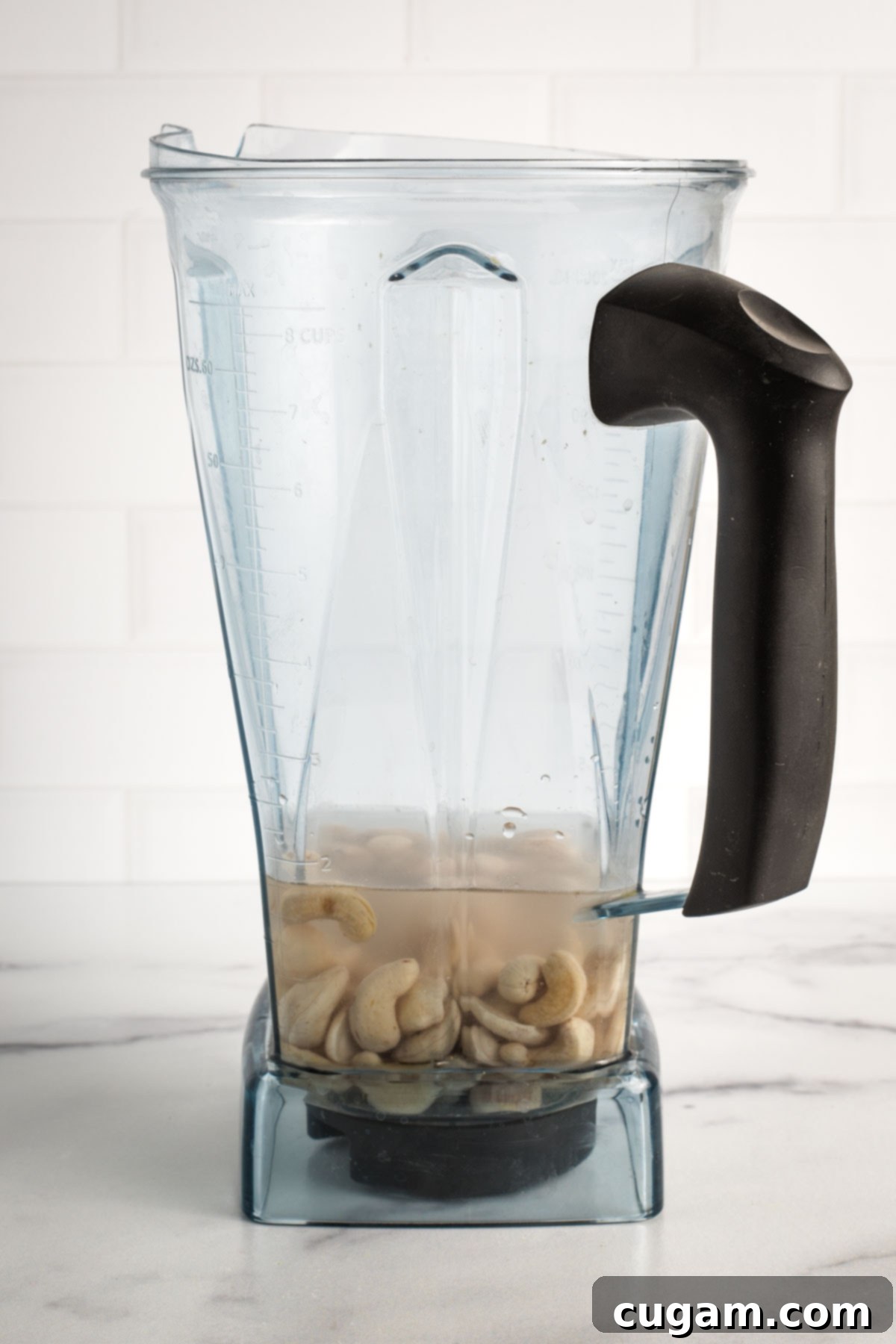 Blender pitcher will soaked cashews plus fresh water.