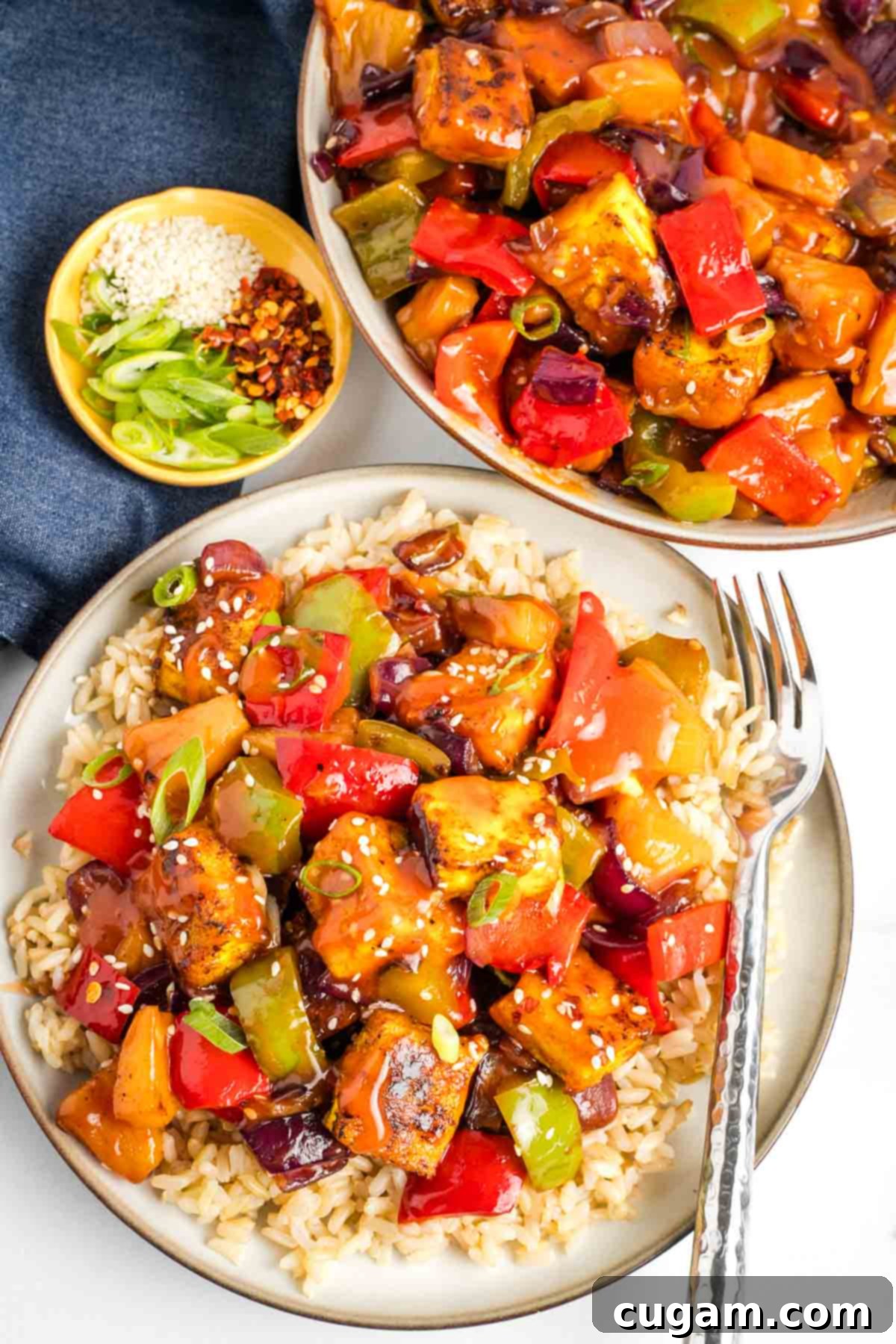 Sticky Sweet and Sour Crispy Tofu 2 Crispy tofu plus bell peppers, onions and pineapple with a sweet and sour sauce, served over rice.