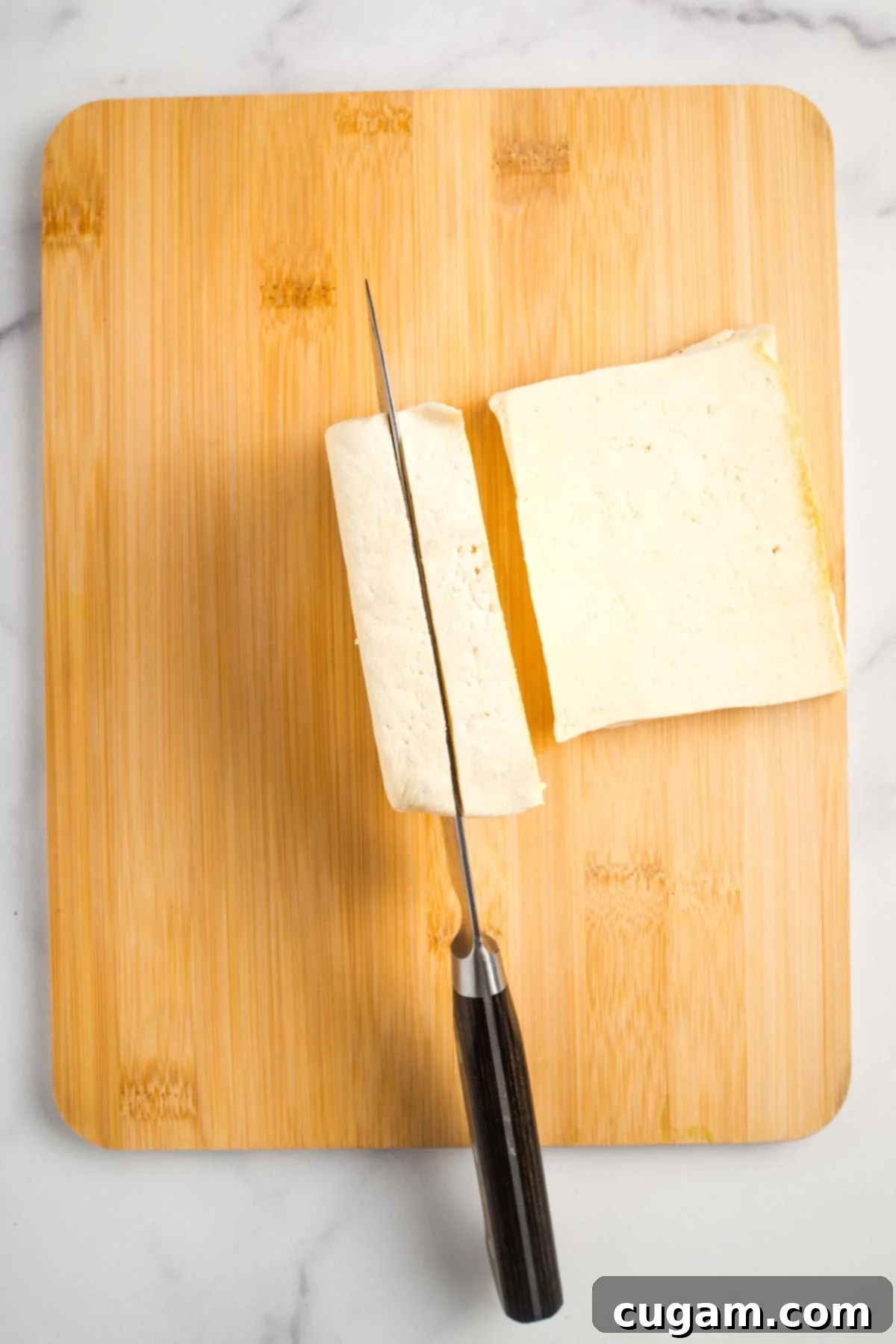 Sticky Sweet and Sour Crispy Tofu 13 Drained and pressed tofu block cut into three even slices.