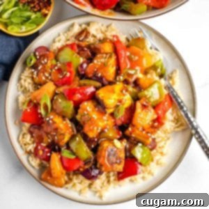 Sticky Sweet and Sour Crispy Tofu 23 Crispy cubes of tofu plus pineapple, green peppers, onions and red peppers with sweet and sour sauce over rice.