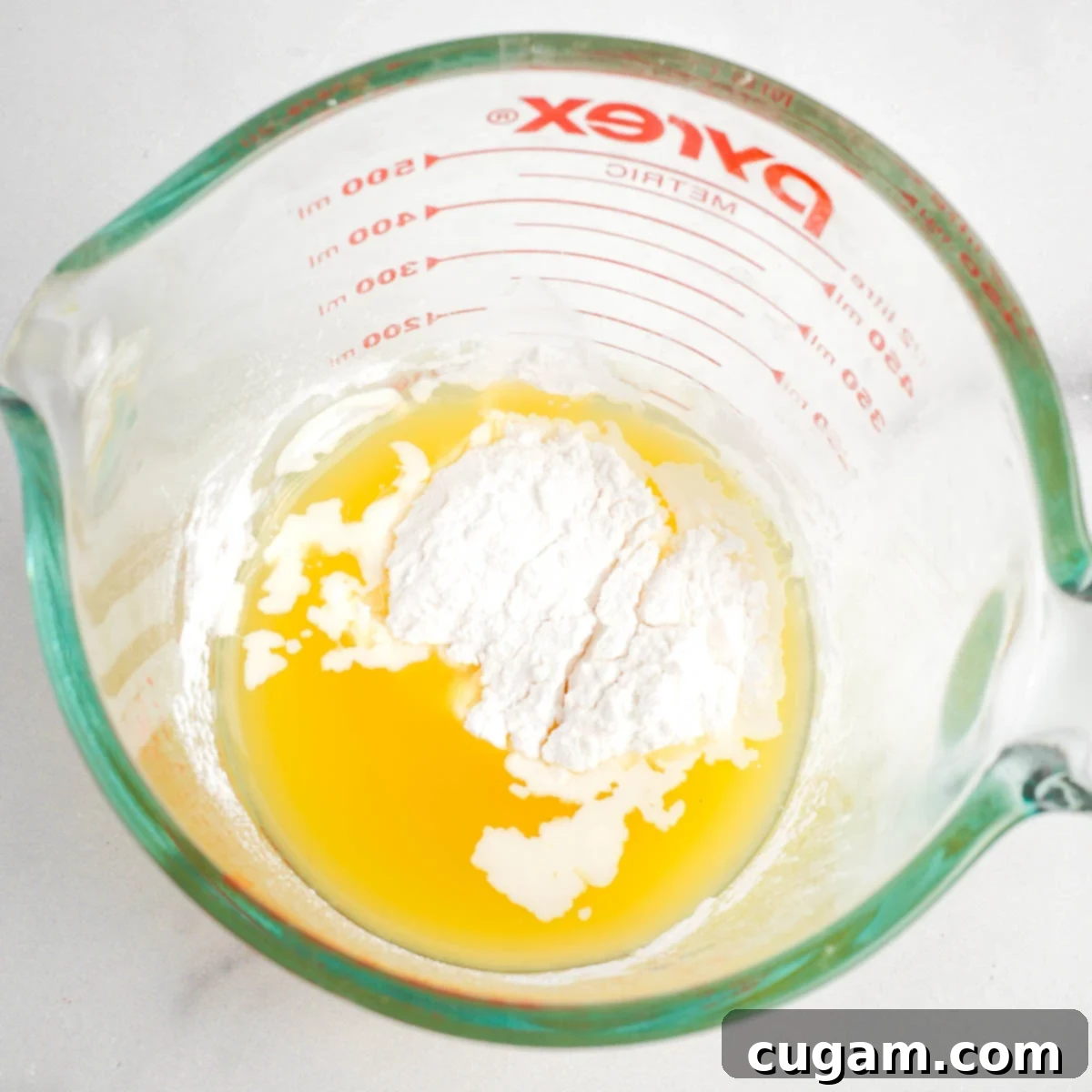 Sticky Sweet and Sour Crispy Tofu 8 Arrowroot powder dissolving in pineapple juice to create a slurry.