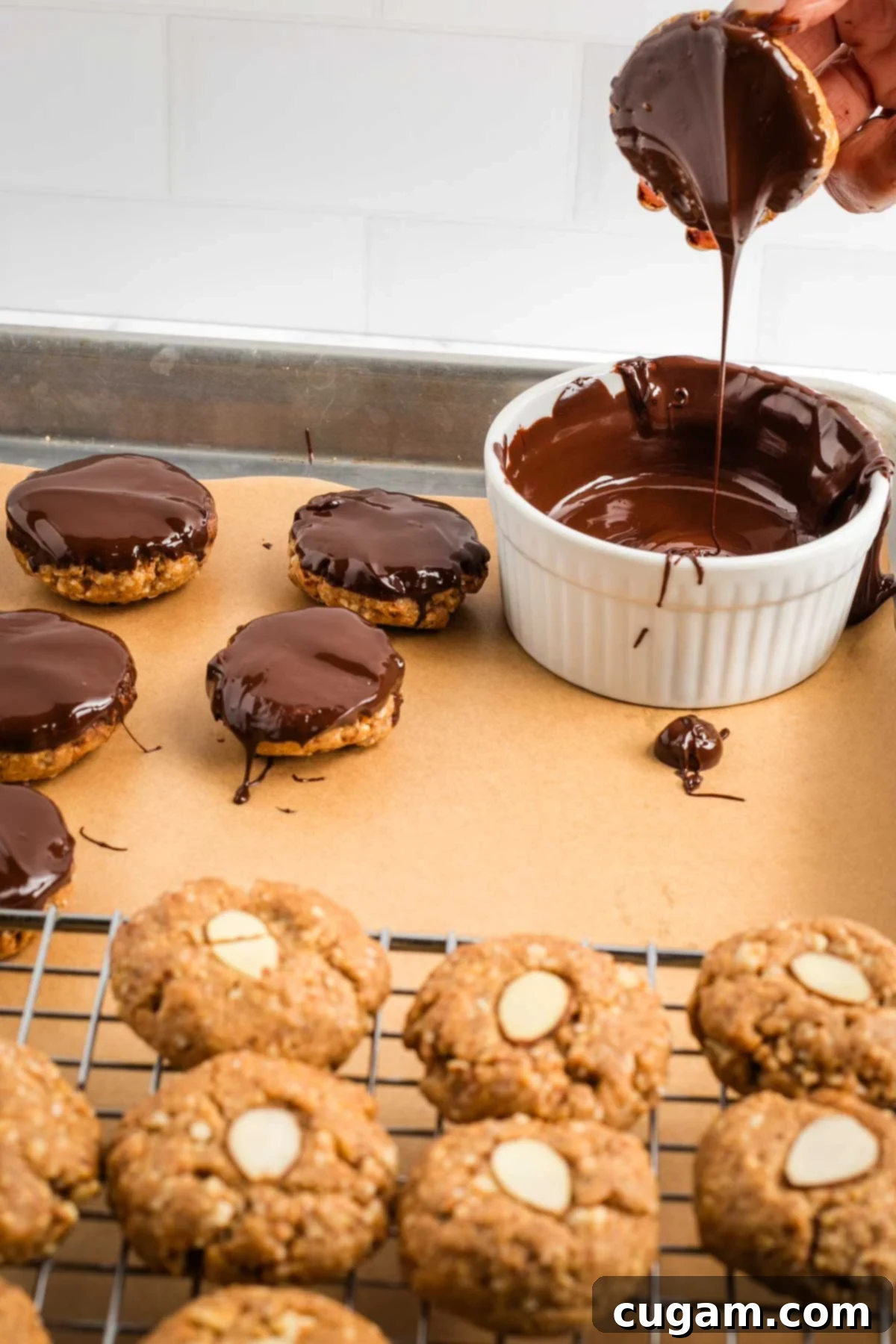 Decadent Vegan Almond Macaroons Enrobed in Chocolate 17 Excess chocolate dripping off an almond macaroon.