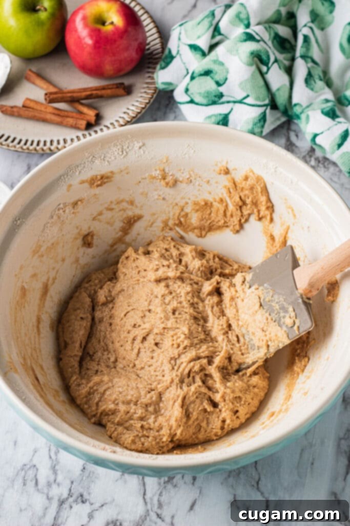 Raw Apple cider donut dough in a white bowl. 