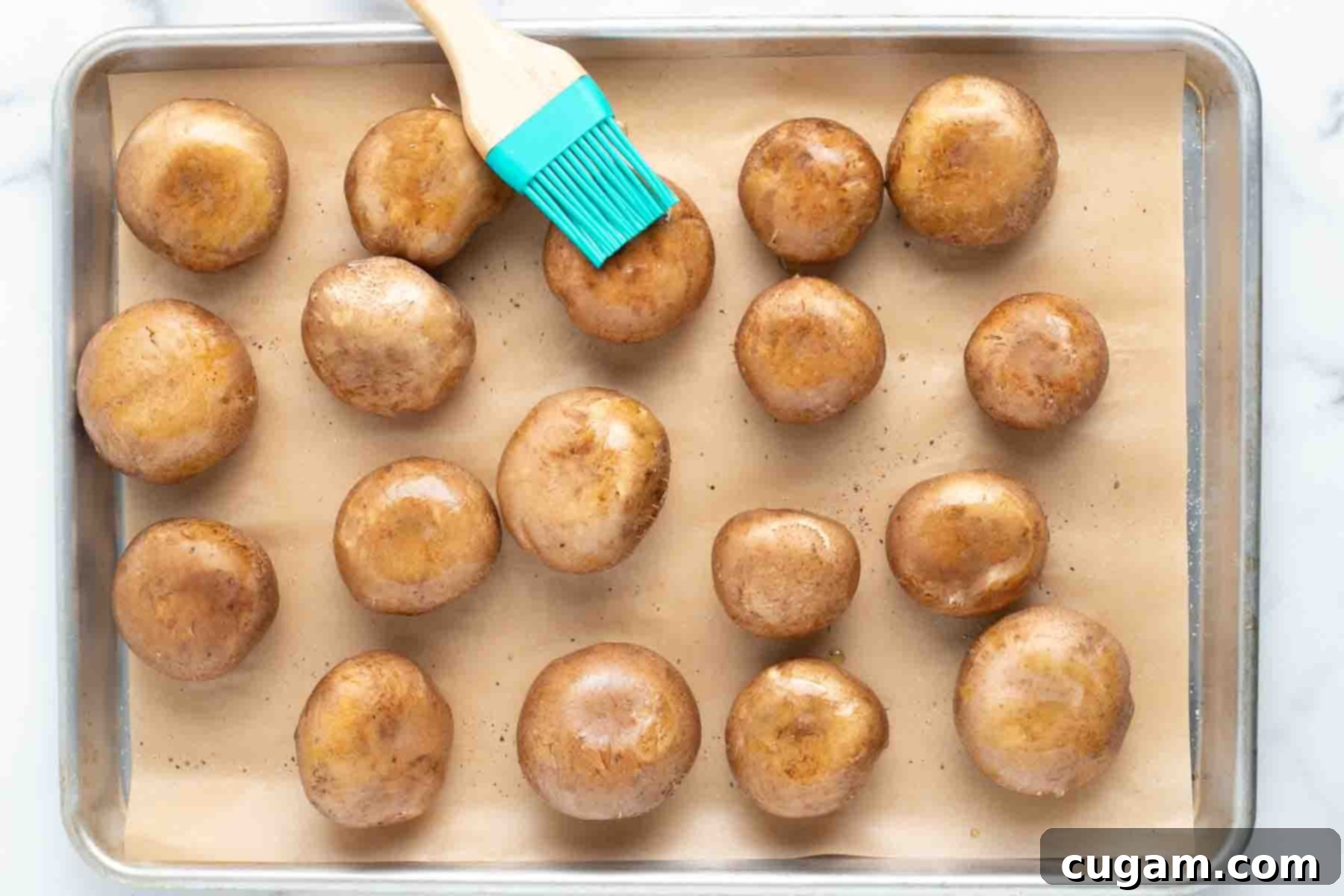Pastry brush, adding oil to mushroom caps.