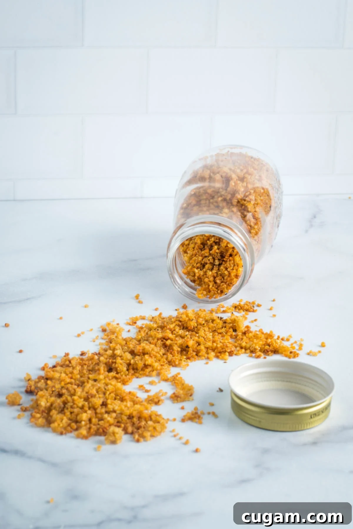 Jar of crispy quinoa spilling out onto the countertop.