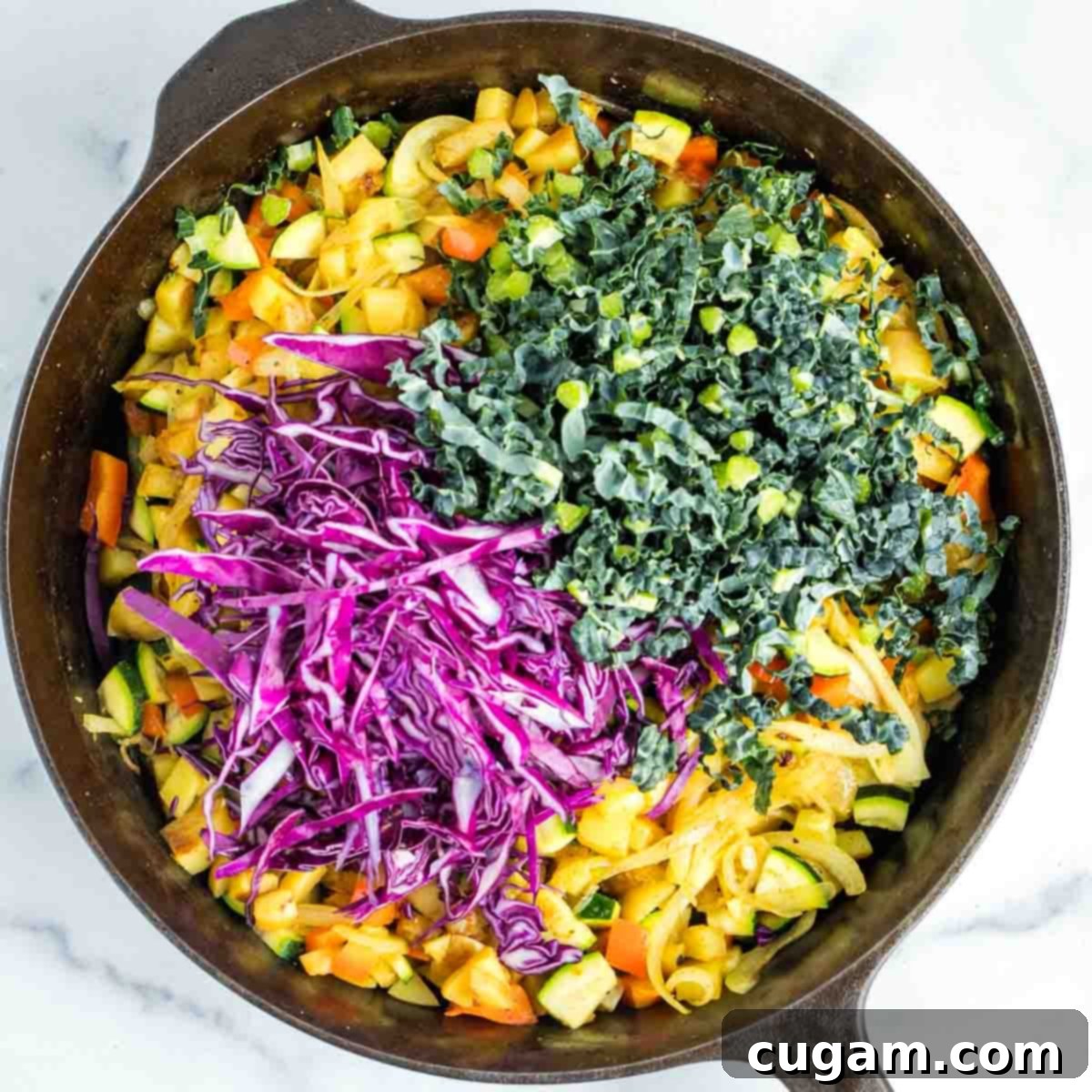 Effortless Vegan Potato and Veggie Skillet 14 Kale and cabbage are added to the skillet, ready to be stirred into the hash and wilted.
