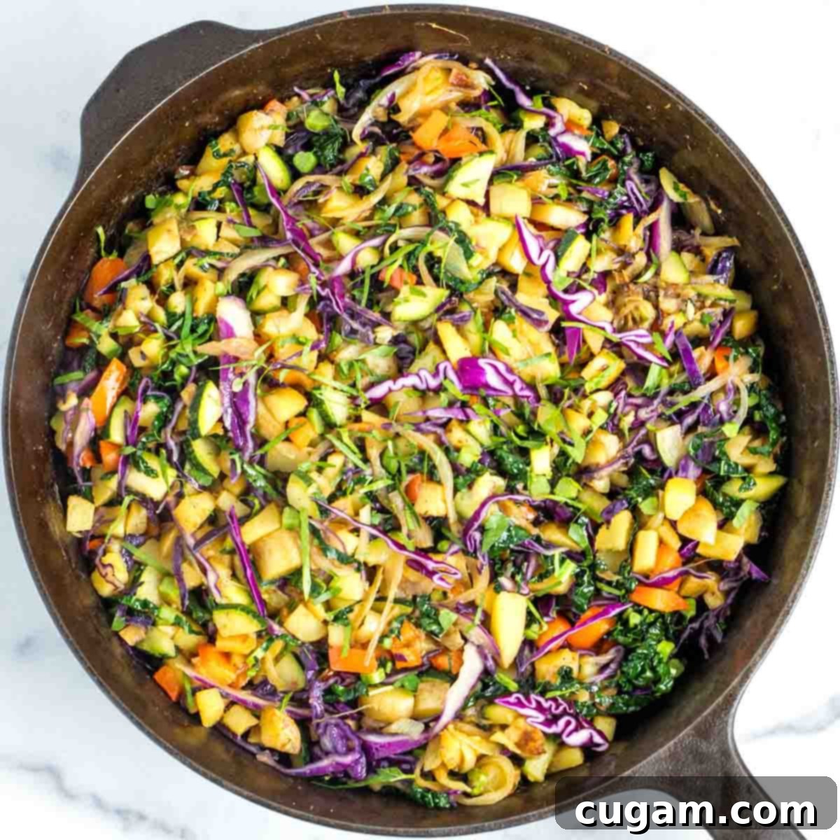 Effortless Vegan Potato and Veggie Skillet 15 The completed vegan potato and veggie hash in the skillet, perfectly cooked and ready to be seasoned.