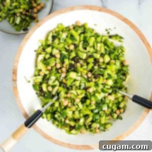 Chopped celery salad with raisins, chickpeas, shallot, cucumber, pistachios and fresh herbs.