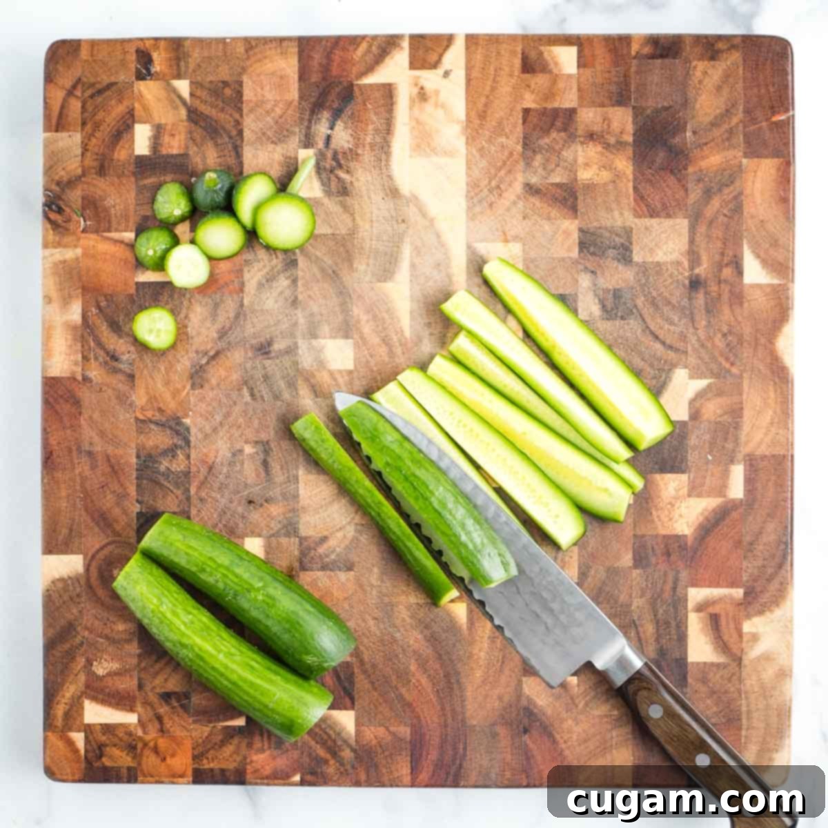 Showing how to cut cucumber into long strips after trimming off the ends.