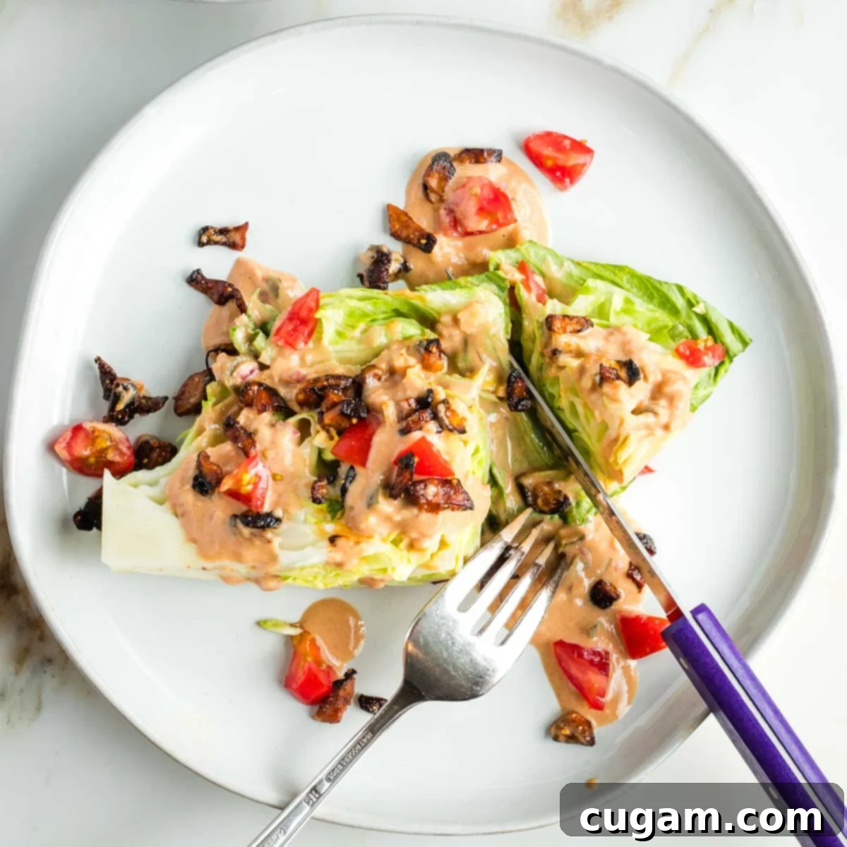 Close-up of a well-dressed vegan wedge salad, highlighting its texture and freshness.