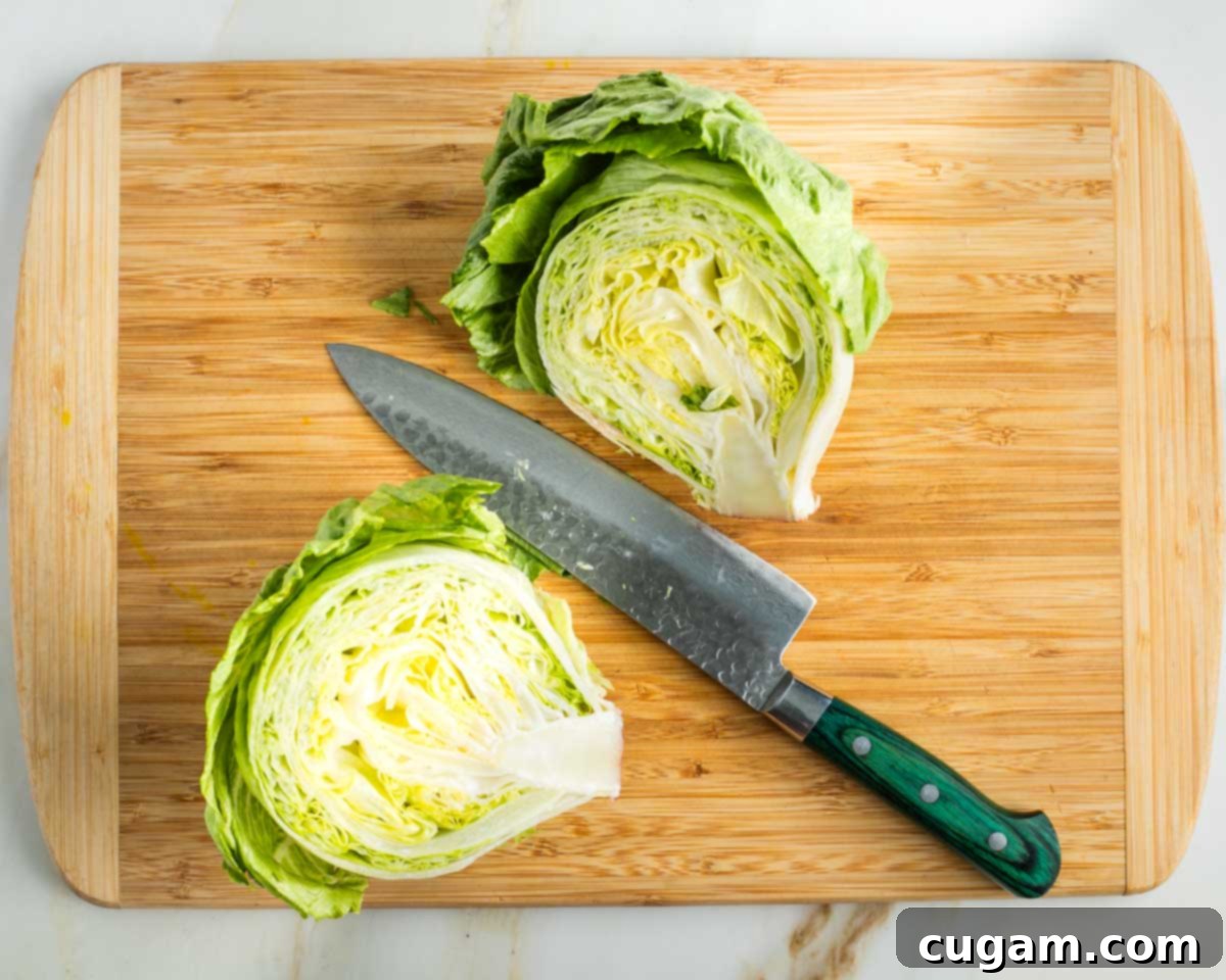 Head of iceberg lettuce cut in half through the core.