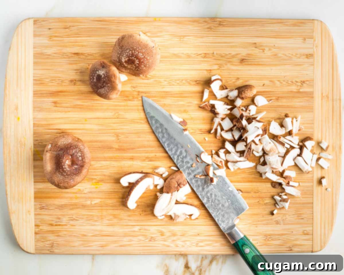Cutting shiitake mushrooms into small dice.