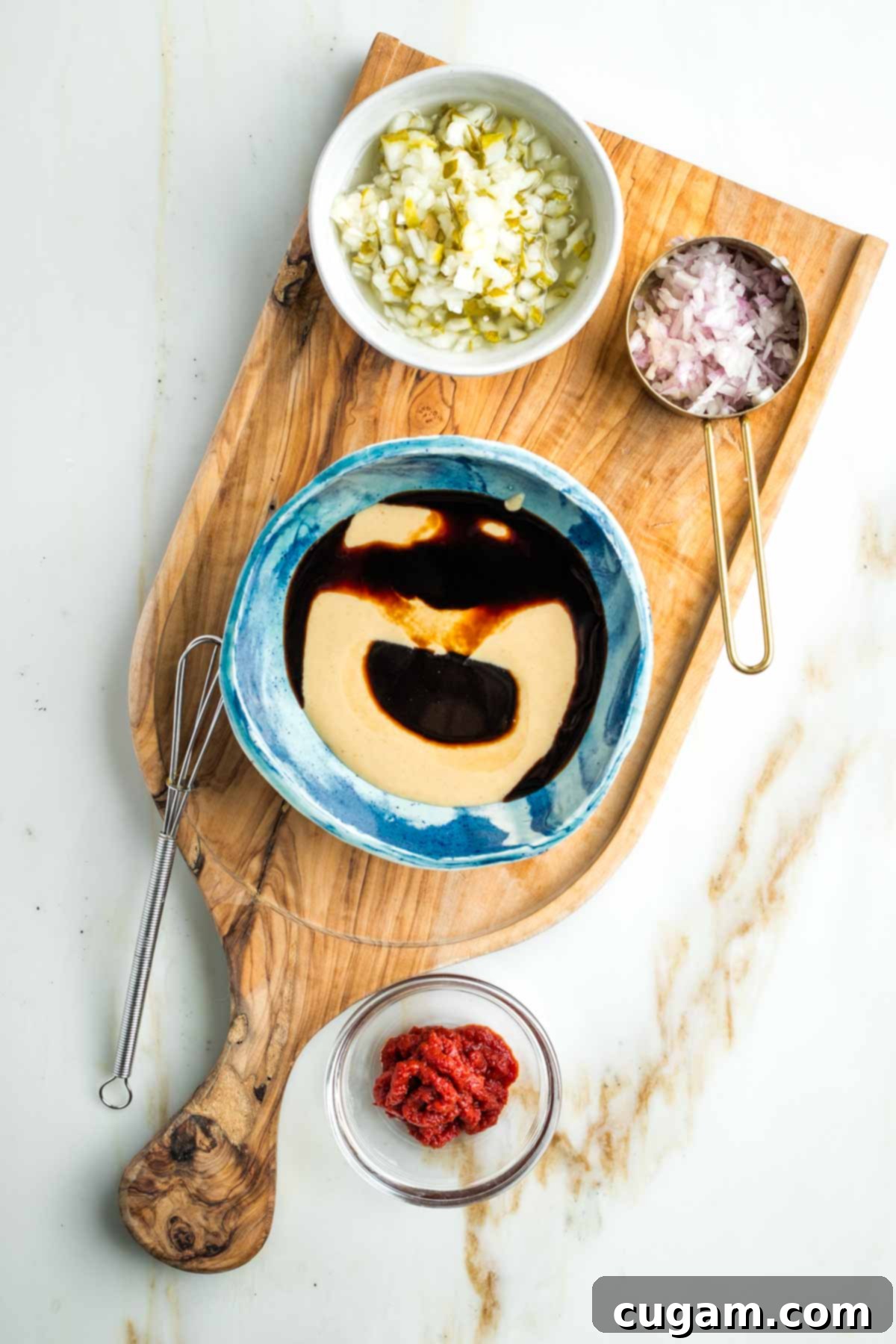 Zesty Russian Slaw 8 Small bowl with tahini, tamari and maple syrup plus dishes with chopped pickles, minced shallot and tomato paste.
