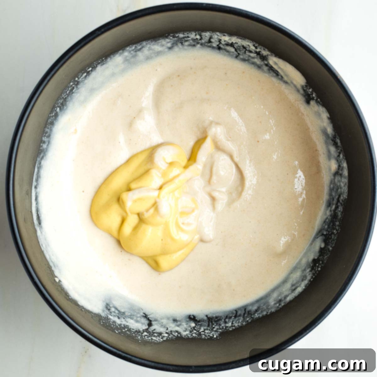 Vegan mayonnaise with a large dollop of dijon mustard.