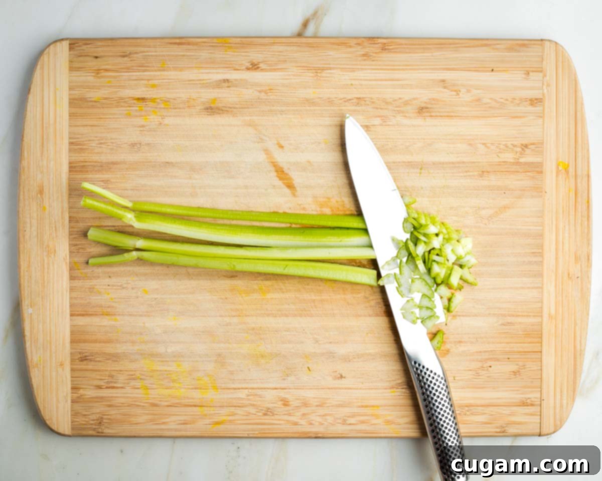One stalk of celery cut lengthwise into strips and then across to make small diced pieces.