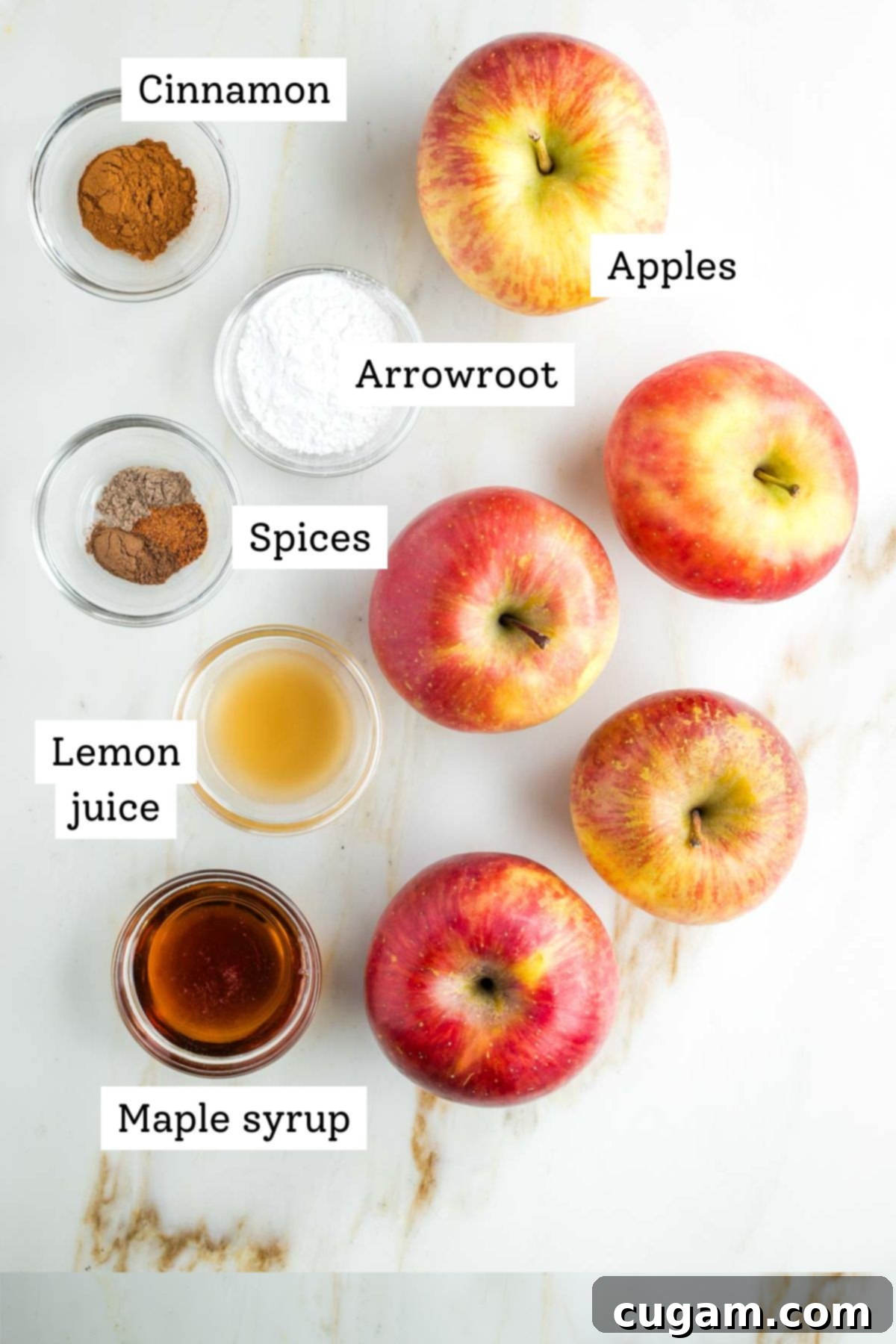 Assortment of fresh fuji apples and spices for the pie filling.