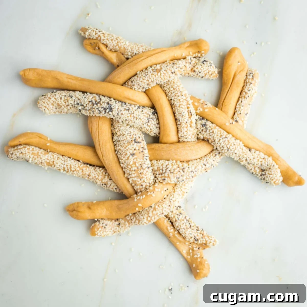 Golden Sweet Round Challah 29 Pairs of seeded or plain strands of dough crossing over in a pattern to form a braided round.