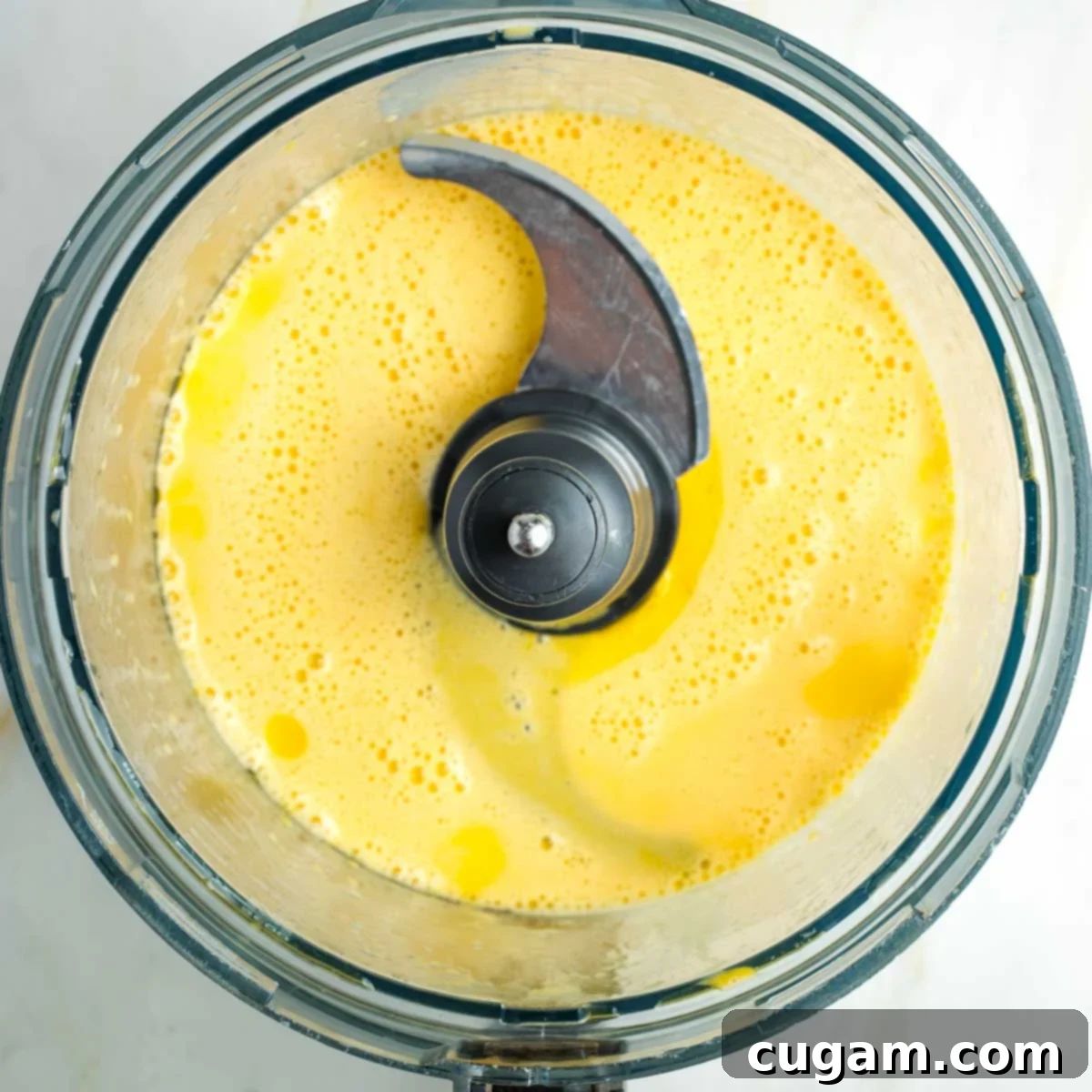 Golden Sweet Round Challah 9 Food processor bowl with whipped eggs and oil.