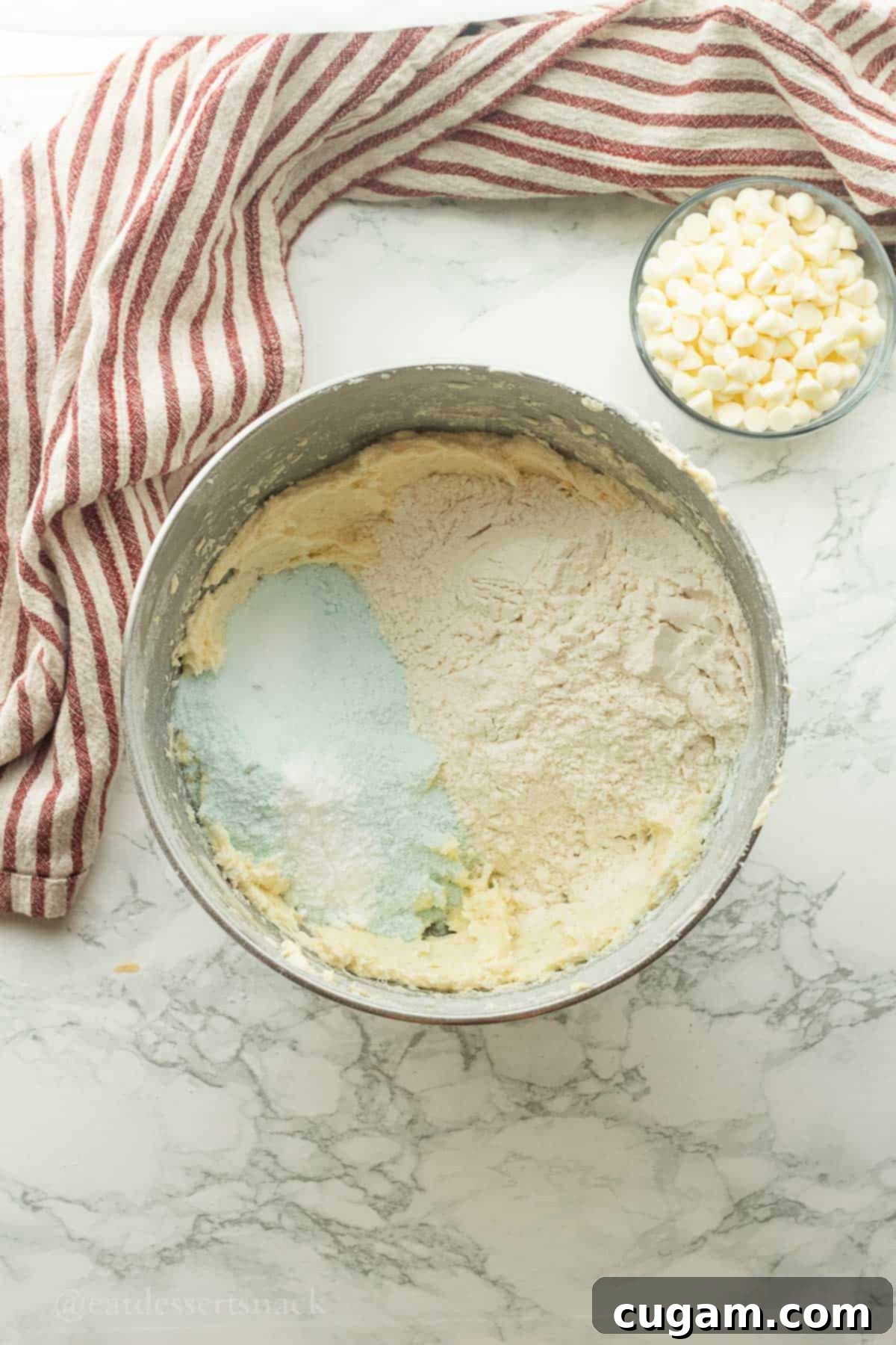 Flour, pistachio pudding mix, and salt in mixing bowl with butter, sugar, and eggs.