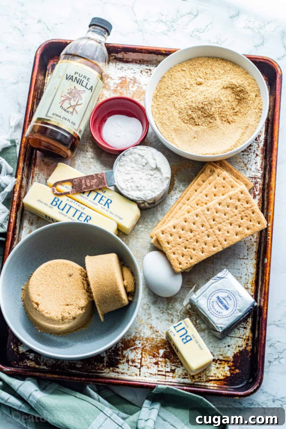 Ingredients for cherry cheesecake cookies on metal pan. 