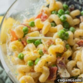 Bowl of cold creamy lemon pasta salad.