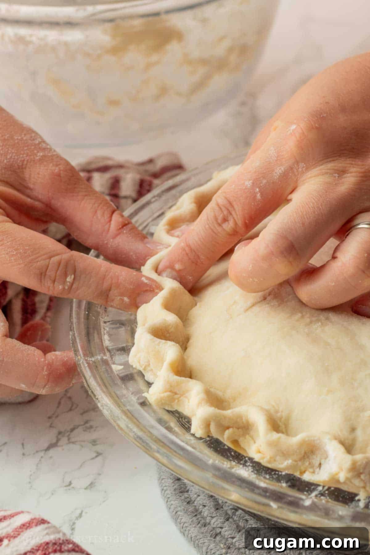 Quick Chicken Pot Pie 10 Fingers crimping raw pie crust.