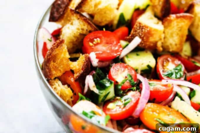 Summer Panzanella with Garlic Butter Bread - this popular Italian salad is a perfect addition to any summer meal or BBQ. Crusty bread that's been infused with garlic butter makes it irresistible.