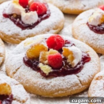 Baked and decorated Raspberry Crumbl Cookie on metal pan.