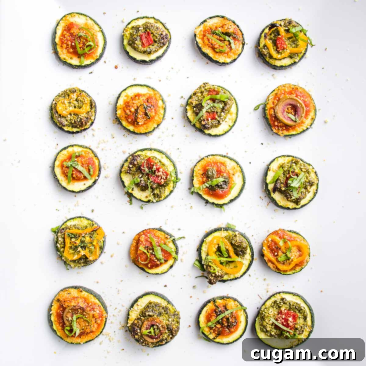 Quick Zucchini Pizza Bites 11 Zucchini rounds baked with pizza toppings, served on a platter.