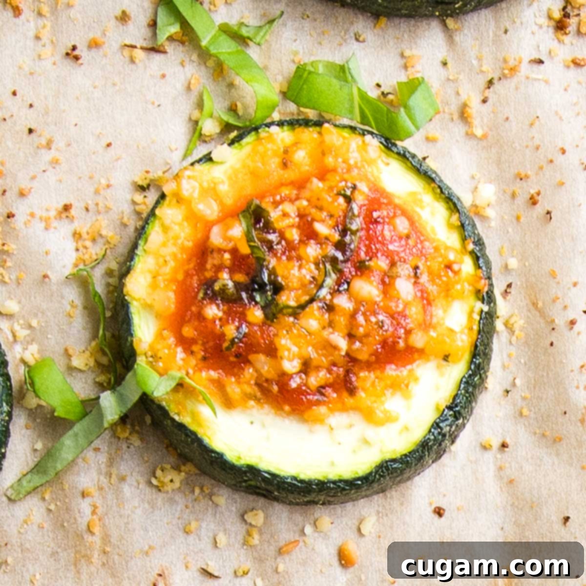 Quick Zucchini Pizza Bites 12 A vibrant display of zucchini pizza bites, garnished with fresh herbs, ready to be served.