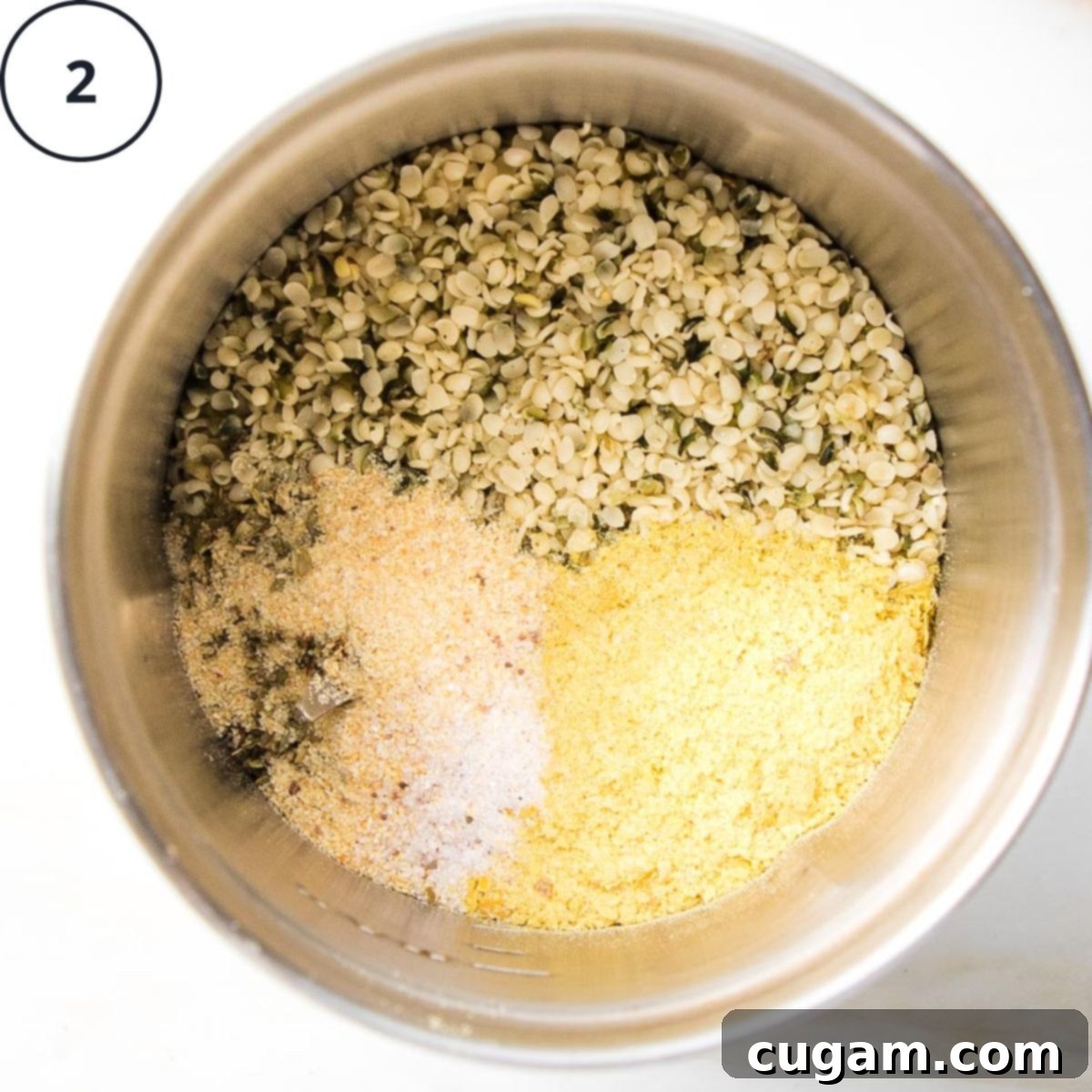 Hemp seeds, nutritional yeast, salt, garlic powder and oregano in a spice grinder.