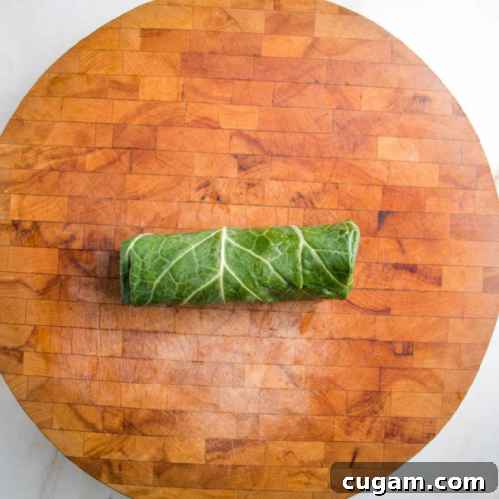 Collard green stuffed and rolled into a small burrito.