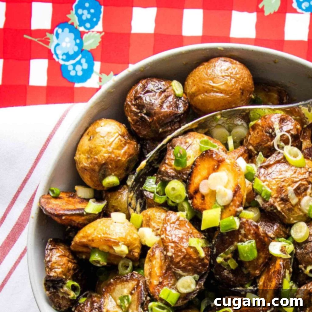 A rustic outdoor setting with a bowl of grilled potato salad and fresh ingredients, capturing the essence of summer dining.