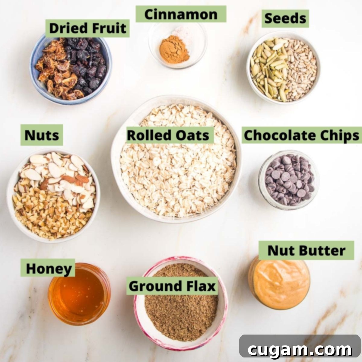 Labeled ingredients for granola bars: rolled oats, ground flax, nut butter, nuts, seeds, dried fruit, chocolate chips, honey
