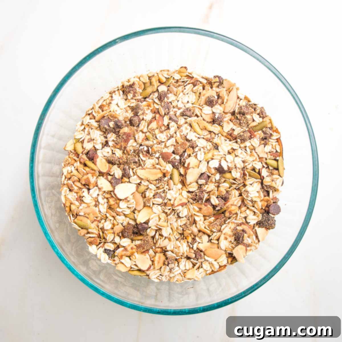Mixture of oats,nuts, seeds, cinnamon, raisins and chocolate chips.
