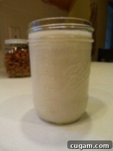 Mason jar filled with almond milk.