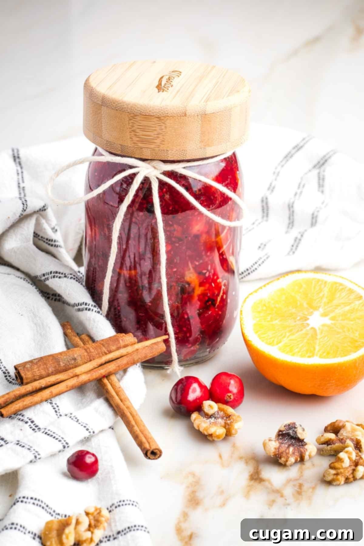 Fresh cranberry sauce stored in a small mason jar.