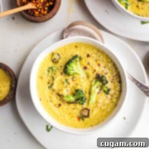 Creamy broccoli soup with chunks of crispy broccoli on top.