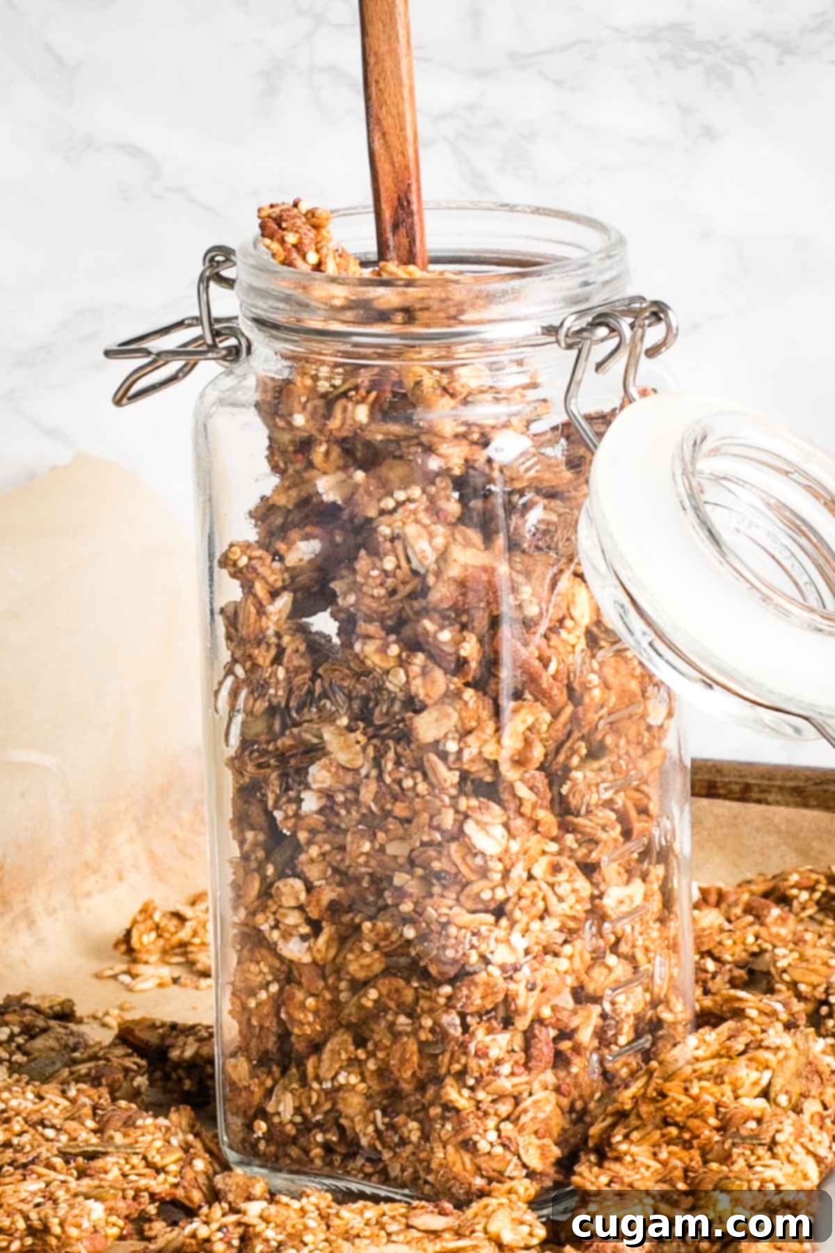 Various glass jars filled with homemade granola, perfectly stored and ready to enjoy.