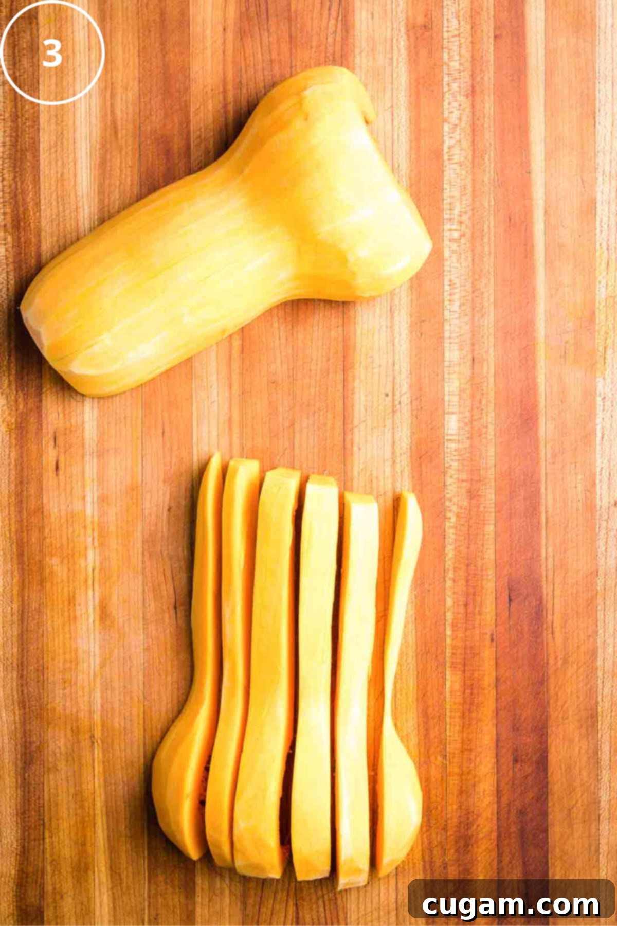 Peeled butternut squash halves. ½" long slices in one half.
