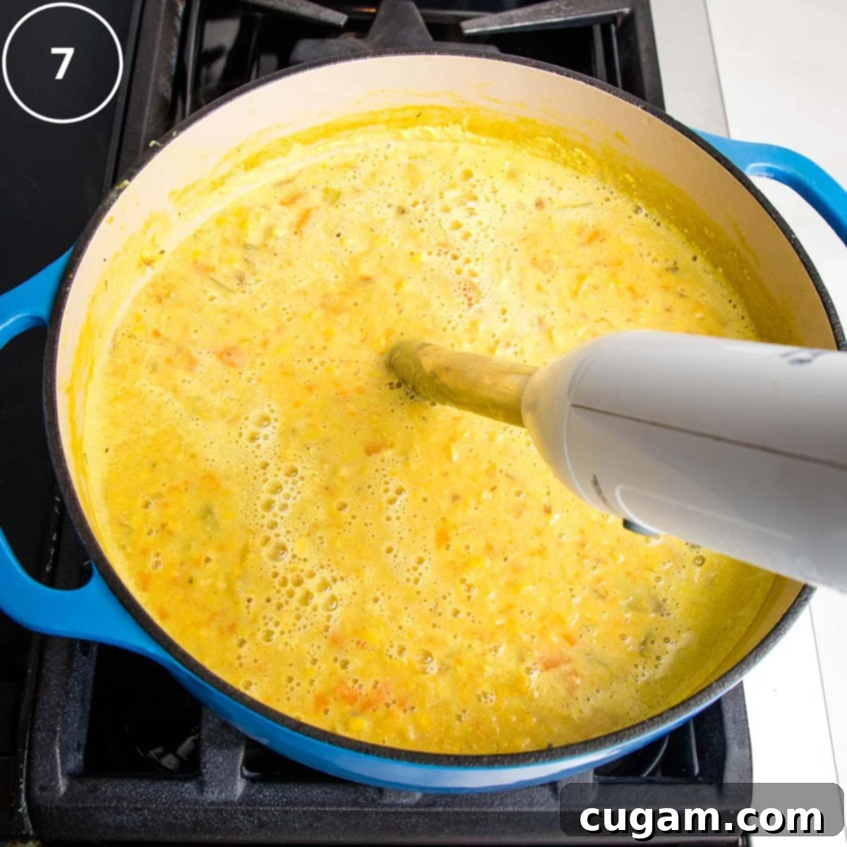 Step 7: Use an immersion blender to puree part of the corn chowder.