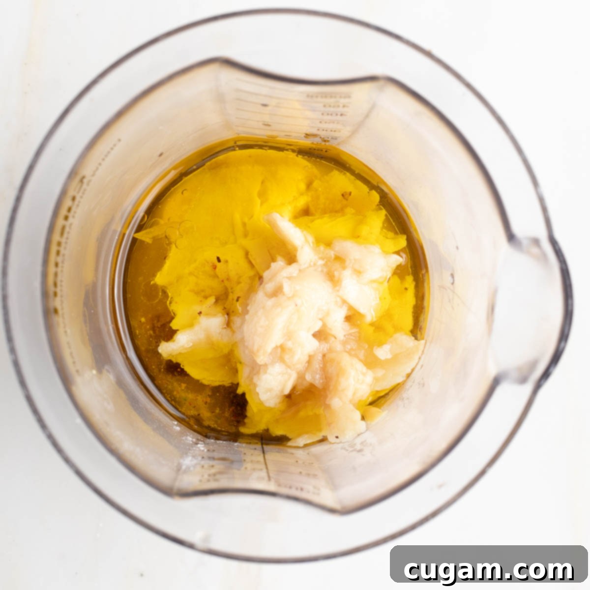 Blended creamy garlic dressing in a blender.