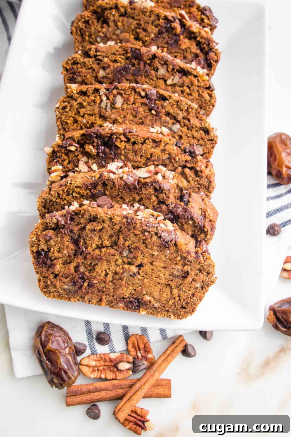 slices of pumpkin bread with chocolate chips on a white plate