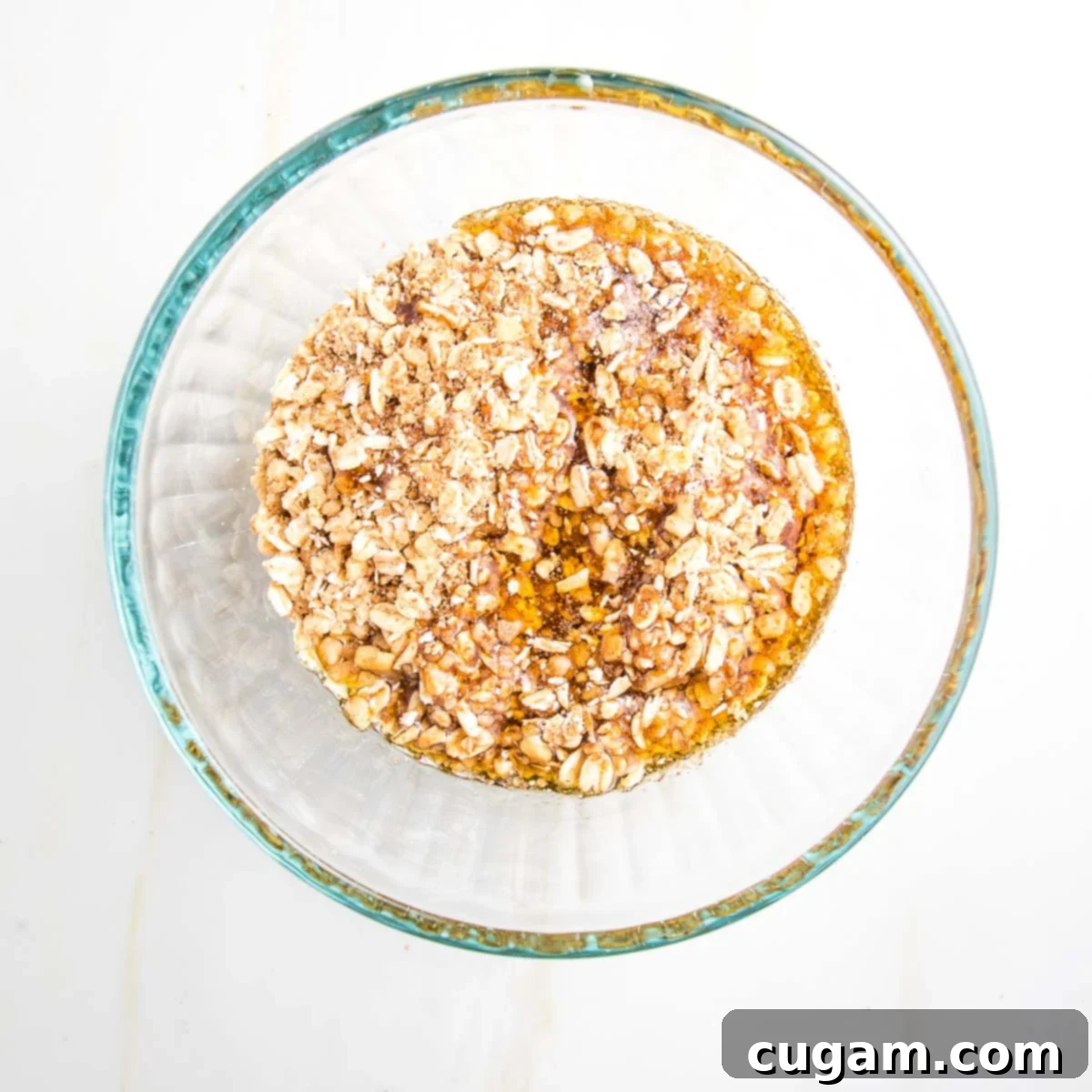 Liquid ingredients in a bowl with the ground oat mixture.