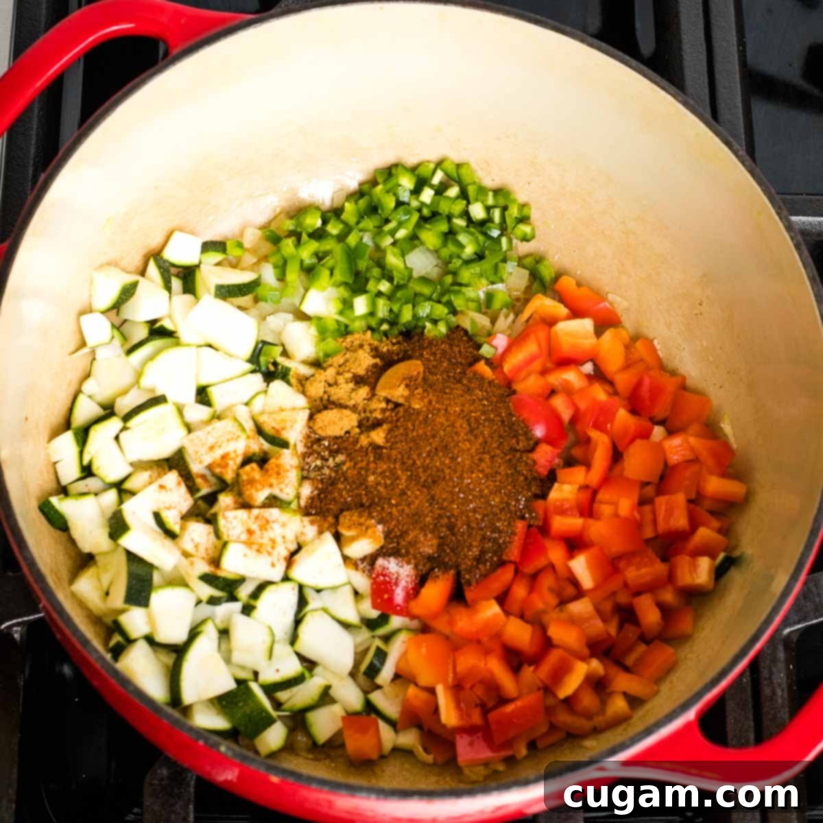 Quick and Easy Vegan Lentil Chili 6 Dutch oven with sauteed onions plus spices, zucchini, red peppers and jalapenos.