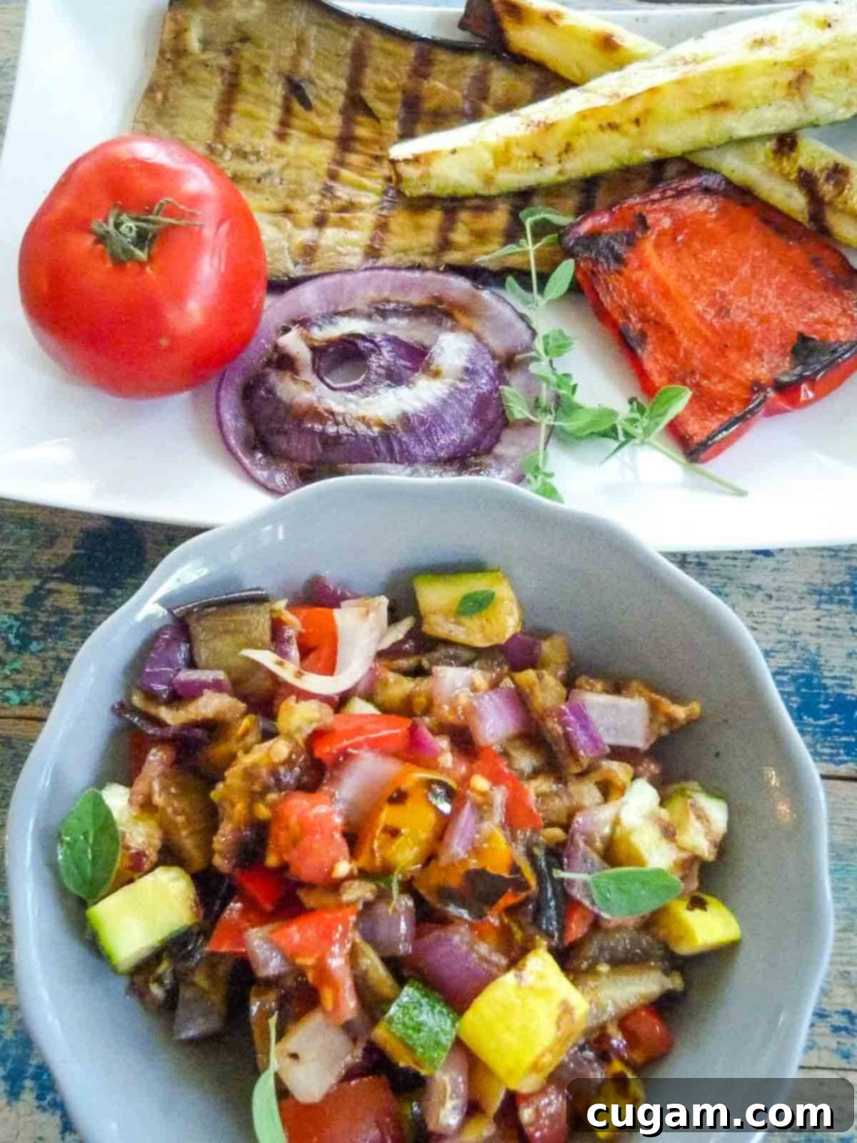 A platter of whole grilled vegetables displayed next to a bowl of the same vegetables, expertly chopped into bite-sized pieces for a ratatouille salad.