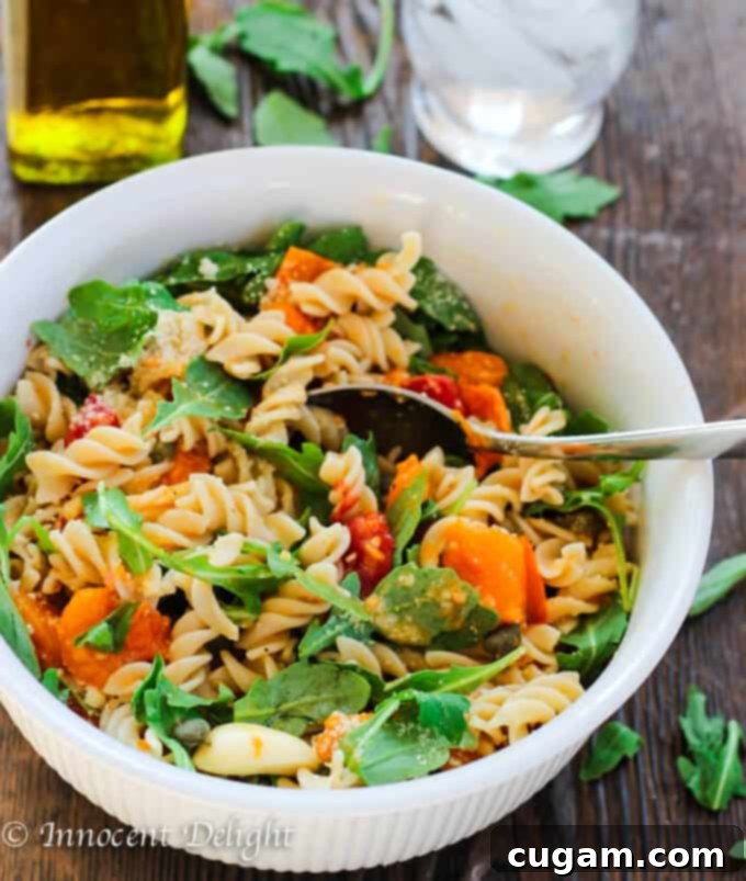 Healthy Quinoa Pasta tossed with a fresh, vibrant, and uncooked tomato sauce.
