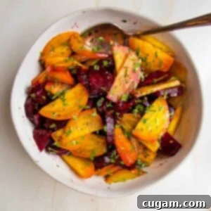 Wedges of whole roasted golden beets and red beets with balsamic, sea salt and chopped fresh parsley.